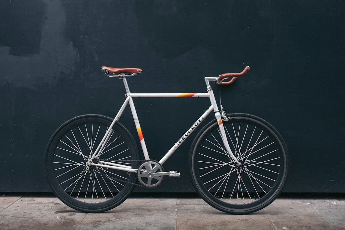 A bicycle with its drivetrain, wheels and other mechanical parts visible