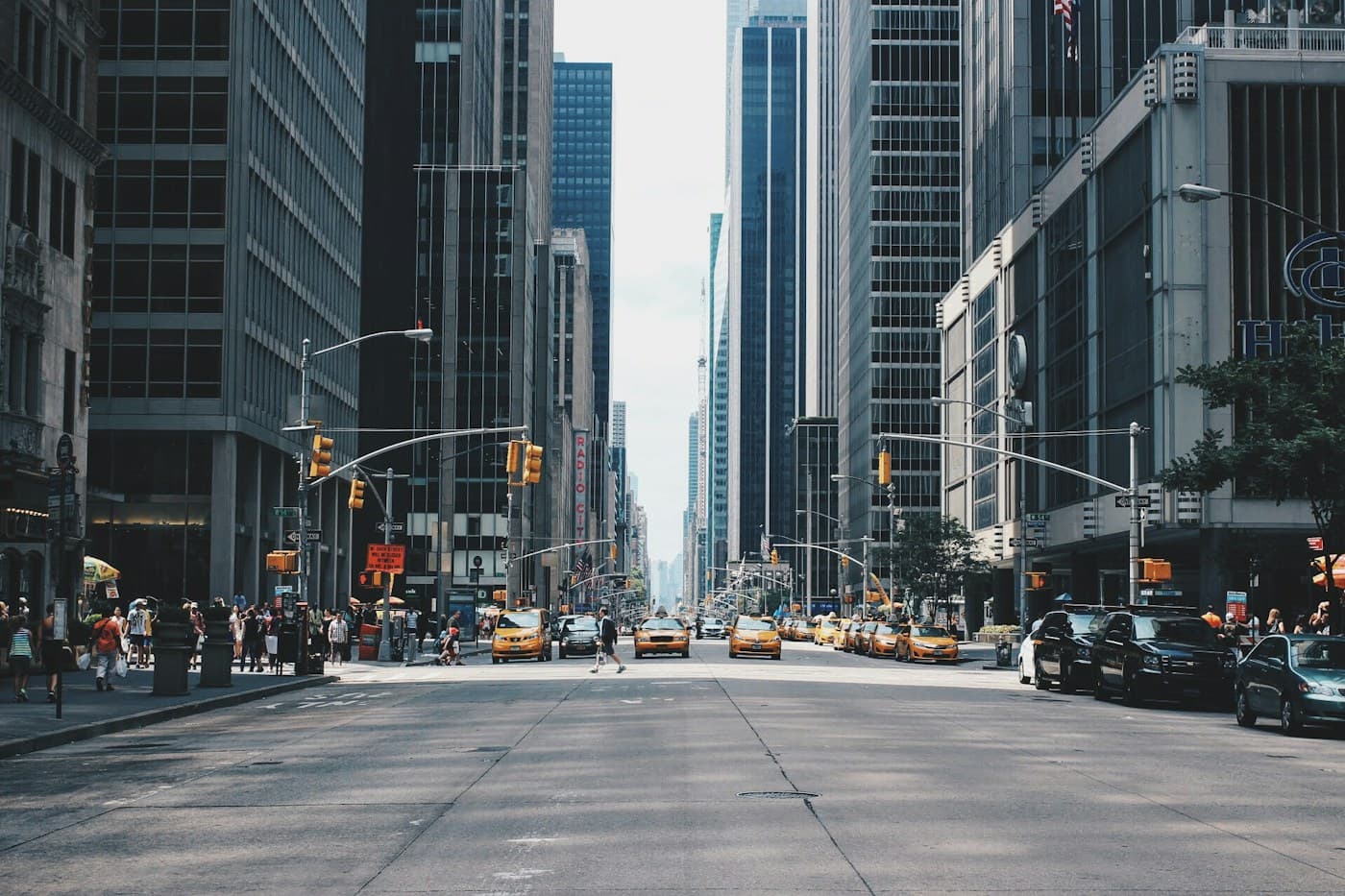 Vehicles and pedestrians sharing a city street
